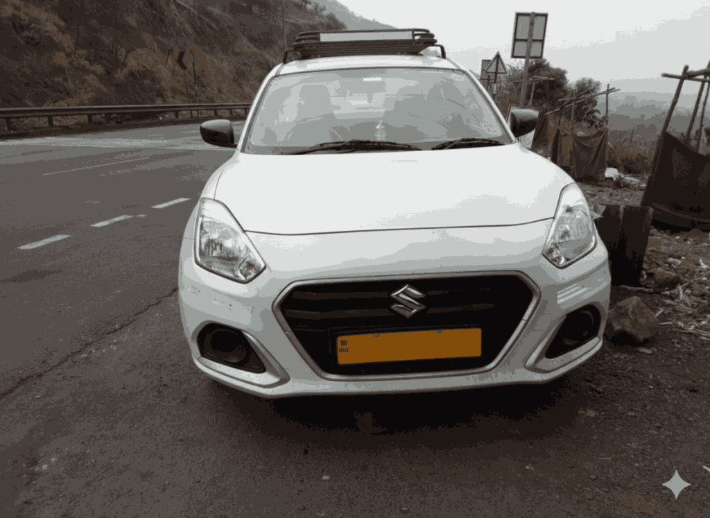 Swift Dzire sedan parked on side of the road and mountain svisible beyond